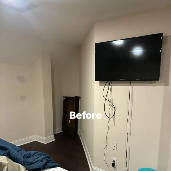 Before view of a prepared bedroom wall around a television