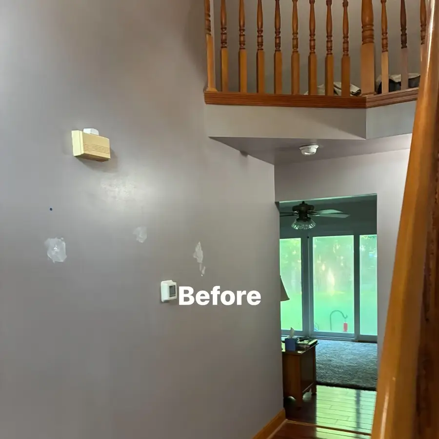 Before view of patched foyer wall in Franklinville