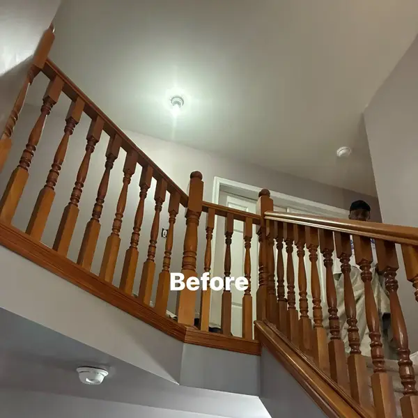 Before view of foyer walls around wood stair railings